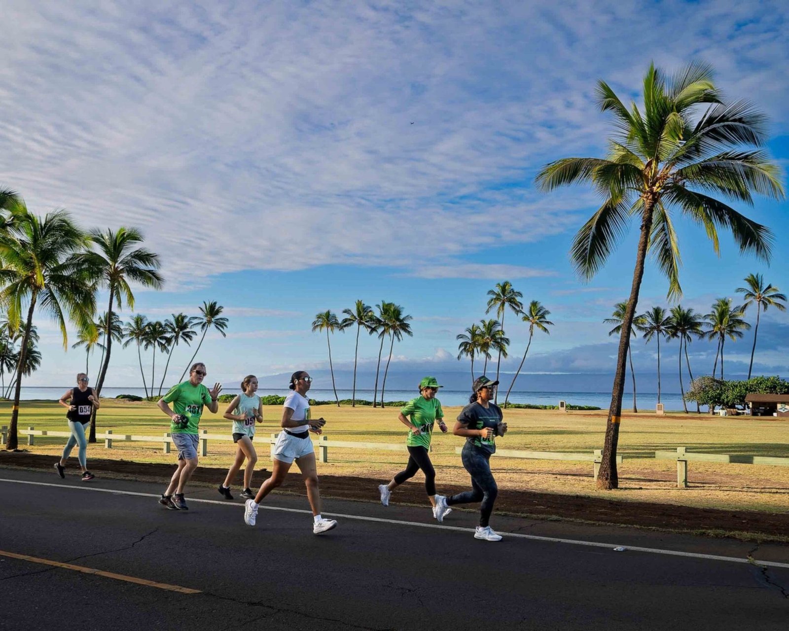 Runners along the Molokai coast