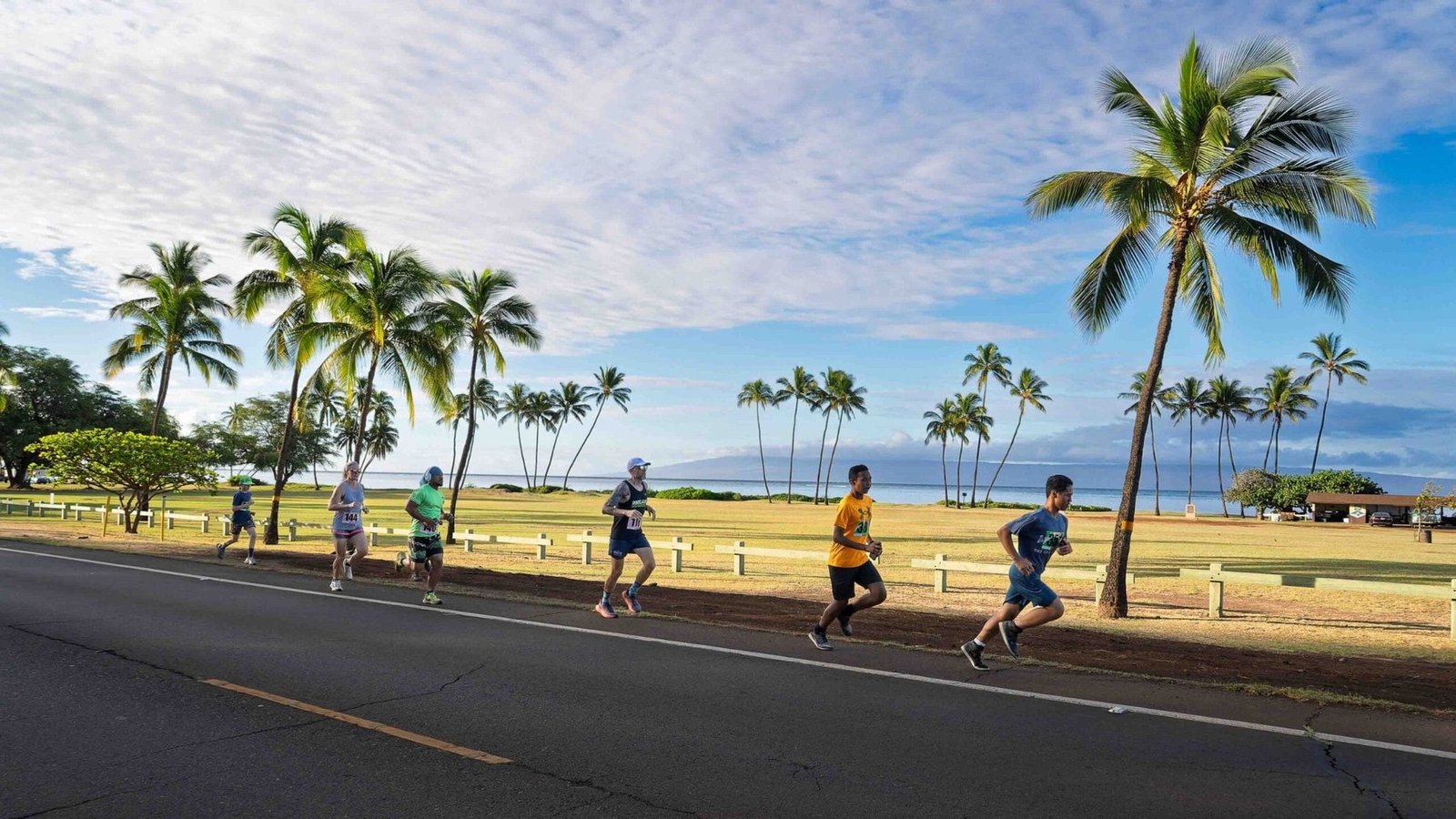Runners beside the ocean